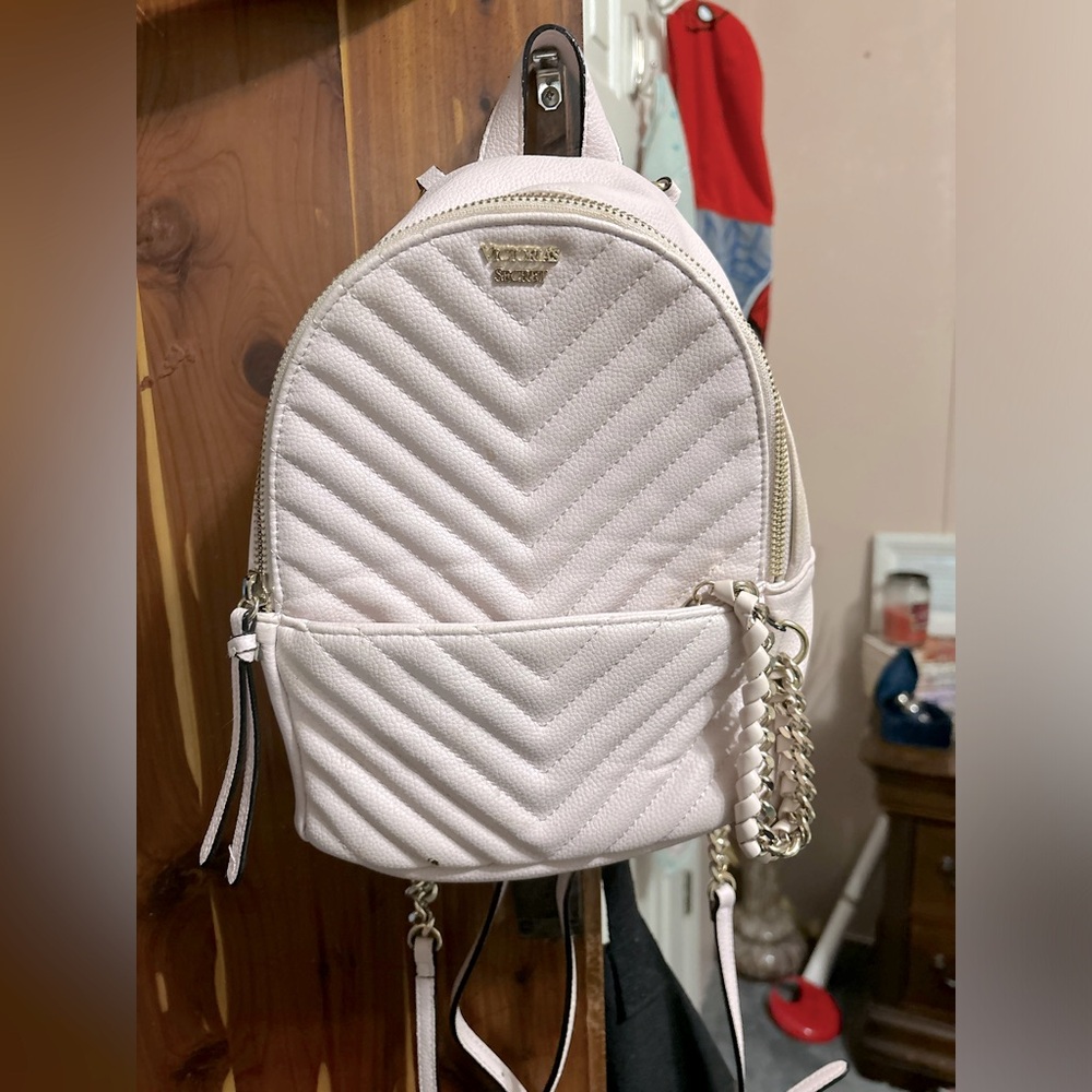 Victoria Secret Mini Backpack baby pink with a Gold Chain.